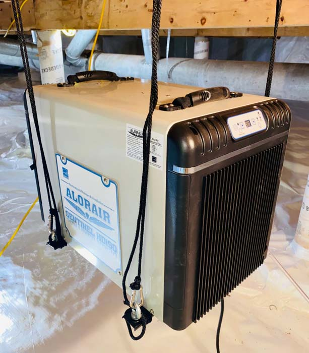 Dehumidifier installation by Guardian Foundation Repair, featuring the Sentinel HDi90 for moisture control.